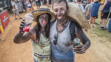 First-time Summernats patrons Amy Judd and Chris Meli of Melbourne have spent five hours in the front row of the ...