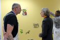 Britain's Prime Minister Theresa May talks to Peter Cheasman during a visit to Thames Reach Employment Academy Centre, ...