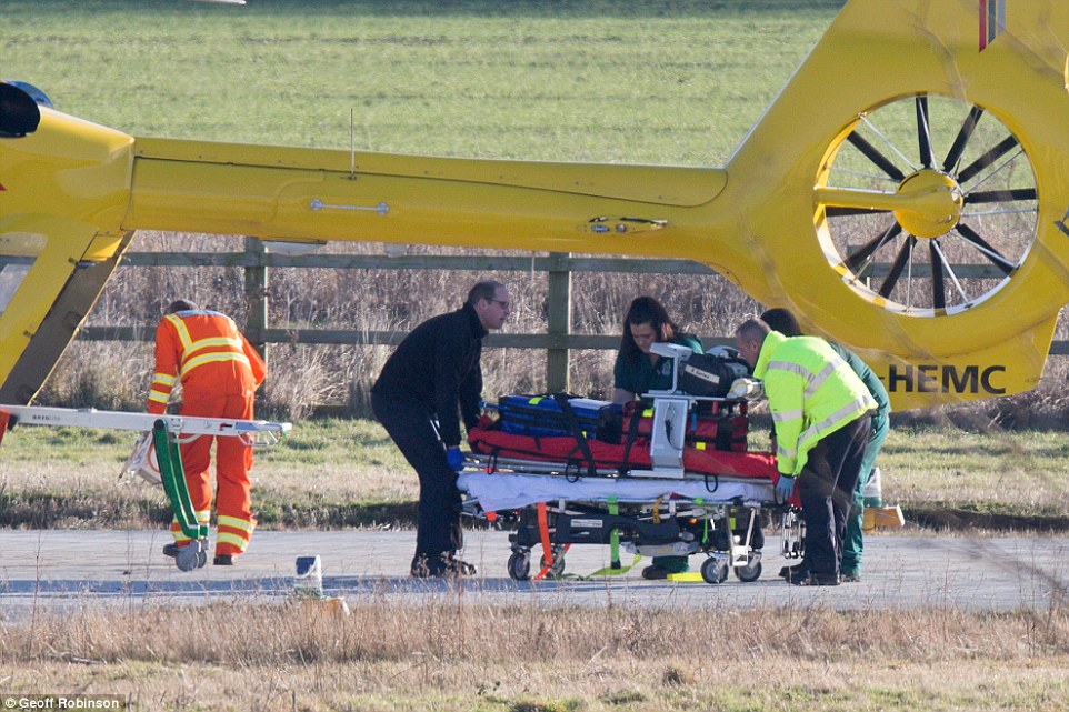 Prince William helped to put back the empty stretcher into the East Anglian Air Ambulance at Addenbrooke's hospital in Cambridge on Thursday afternoon