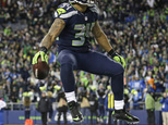 Seattle Seahawks running back Thomas Rawls celebrates after he rushed for a touchdown against the Detroit Lions in the second half of an NFL football NFC wil...