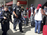 A heavy police presence was at the Ft. Lauderdale-Hollywood International Airport after it re-opened Saturday, Jan. 7, 2017. Investigators continued their wo...