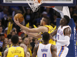 Denver Nuggets forward Danilo Gallinari, left, shoots in front, of Oklahoma City Thunder guard Victor Oladipo (5) in the fourth quarter of an NBA basketball ...