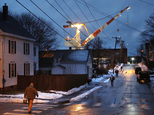 In this Wednesday, Jan. 4, 2017 photo, shipyard workers walk to work at Bath Iron Works in Bath, Maine. With President-elect Donald Trump demanding more ship...