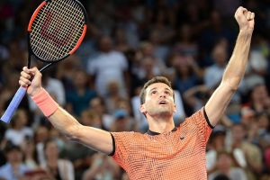 Run of form: Grigor Dimitrov celebrates victory against Kei Nishikori.