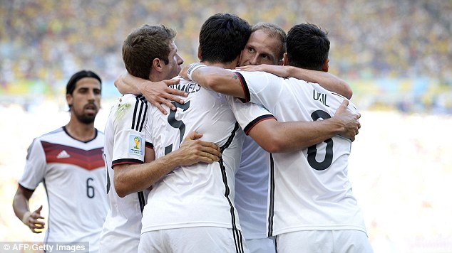 Opener: Germany celebrate after their first goal to get them on their way to the World Cup semi-finals