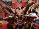 A devil dancer takes part in "La Diablada" festival in Pillaro, Ecuador, Friday, Jan. 6, 2017. Thousands of singing and dancing devils take over a mountain town in Ecuador for six days of revelry in the streets. (AP Photo/Dolores Ochoa)