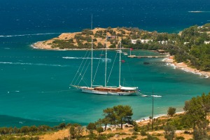 A gulet (traditional Turkish wooden sailing vessel) moors in scenic Bodrum.
