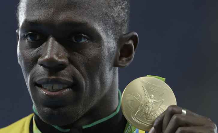 Jamaica's Usain Bolt celebrates with the gold medal after winning the men's 100-meter final during the athletics competitions of the 2016 Summer Olympics at the Olympic stadium in Rio de Janeiro, Brazil, Monday, Aug. 15, 2016. (AP Photo/Natacha Pisarenko)