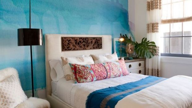 Nod off to sleep dreaming of the sea with wall art reminiscent of waves. 