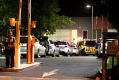 Police vehicles at Melbourne Youth Justice Centre in Parkville late on Saturday night.