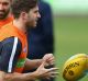 MELBOURNE, AUSTRALIA - MAY 25: Marc Murphy of the Blues handballs during a Carlton Blues AFL training session at Ikon ...