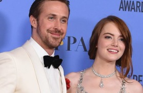 Ryan Gosling, left, and Emma Stone pose in the press room.