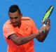 Met with boos: Nick Kyrgios on his way to a straight sets Hopman Cup loss to Jack Sock in Perth last week.