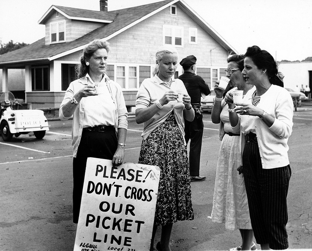 Four female members of ILGWU Local 221 drinking coffee as they picket