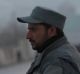 A member of the Afghan security forces stands guard near the site of two blasts in Kabul on Tuesday. 