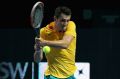 Streamlined: Bernard Tomic plays a backhand during the Fast4 International Exhibition match against Dominic Thiem.