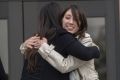 Michelle Hadley, right, hugs Orange County District Attorney Chief of Staff Susan Kang Schroeder after being cleared of ...