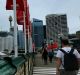 A man walks over the Pyrmont Bridge, crossing Darling Harbour, linking Pyrmont to the city CBD. 22nd January, 2014. ...