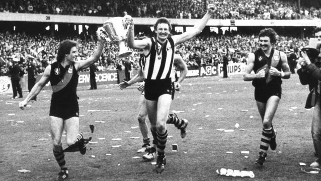 Richmond players Geoff Raines, Michael Roach (wearing a Collingwood guernsey) and Mick Malthouse after their grand final ...