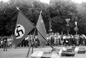 Demonstration in Šiauliai. The coffins are decorated with national flags of the three Baltic states and are placed under Soviet and Nazi flags.