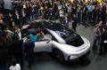 People gather around the Faraday Future's FF91 electric car at CES International Thursday, Jan. 5, 2017, in Las Vegas. ...