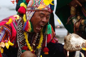 A shaman performs in an annual pre-New Year ceremony, at Agua Dulce beach in Lima, Peru, Thursday, Dec. 29, 2016. The ...