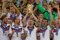 Germany's Bastian Schweinsteiger holds up the World Cup in 2014.
