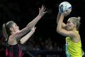 Australia's Courtney Bruce looks for a pass over New Zealand's Ta Paea Selby-Rickit.