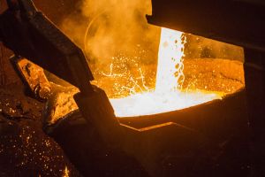 Molten copper flows from a furnace into a ladle at the Aurubis AG metals plant in Hamburg, Germany, on Thursday, April ...