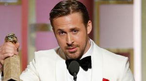 Ryan Gosling with the award for best actor in a motion picture musical or comedy for <i>La La Land</i>.