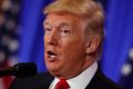 President-elect Donald Trump speaks during a news conference in the lobby of Trump Tower in New York Wednesday, Jan. 11, ...