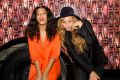 Solange Knowles (L) and Beyonce Knowles pose for a photo against the bounce bus at the cocktail reception for "Amen ...