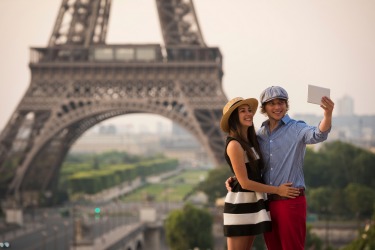 A selfie in front of the Eiffel Tower.