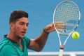 Thanasi Kokkinakis has been forced to withdraw from the Sydney International with an abdominal injury.
