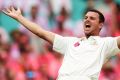 Caught in the middle: Josh Hazlewood.