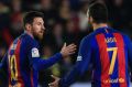 Lionel Messi celebrates his stunner with teammates.