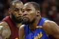 Golden State's Kevin Durant, left, drives to the basket against Cavalier Richard Jefferson.
