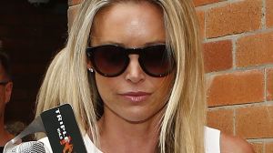 Former TV presenter Kelly Landry, wife of Anthony Bell, leaves Waverley Local Court.