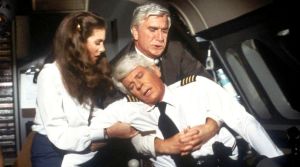 Passengers were lucky Dr. Rumack (Leslie Nielsen, rear) was on board in 1980 comedy film Flying High.