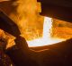 Molten copper flows from a furnace into a ladle at the Aurubis AG metals plant in Hamburg, Germany, on Thursday, April ...