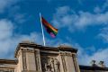 The rainbow flag flying at Parliament House.