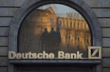 A logo sits outside a Deutsche Bank AG bank branch in Frankfurt, Germany, on Tuesday, Oct. 4, 2016. Speculation about ...