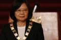 Taiwan's President Tsai Ing-wen poses for photos after she received Guatemala's highest honor 'Orden del quetzal' on ...