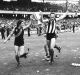 Richmond players Geoff Raines, Michael Roach (wearing a Collingwood guernsey) and Mick Malthouse after their grand final ...