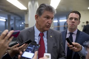 In this June 20, 2016, file photo, Sen. Joe Manchin, D-W.Va., talks with reporters on Capitol Hill in Washington.