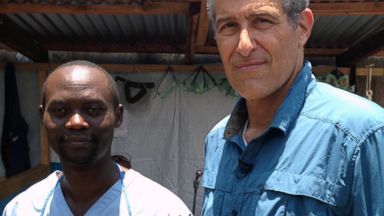 PHOTO: Dr. David Kaggwa and Dr. Richard Besser at an Ebola ward in Monrovia, Liberia.