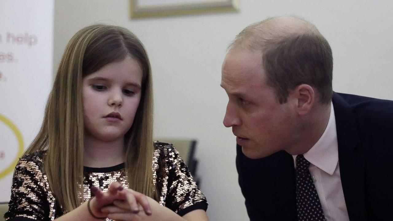 In this Wednesday, Jan. 11, 2017 file photo, Britains Prince William speaks to Aoife, 9, during his visit to a Child Bereavement UK Centre in Stratford in east London.