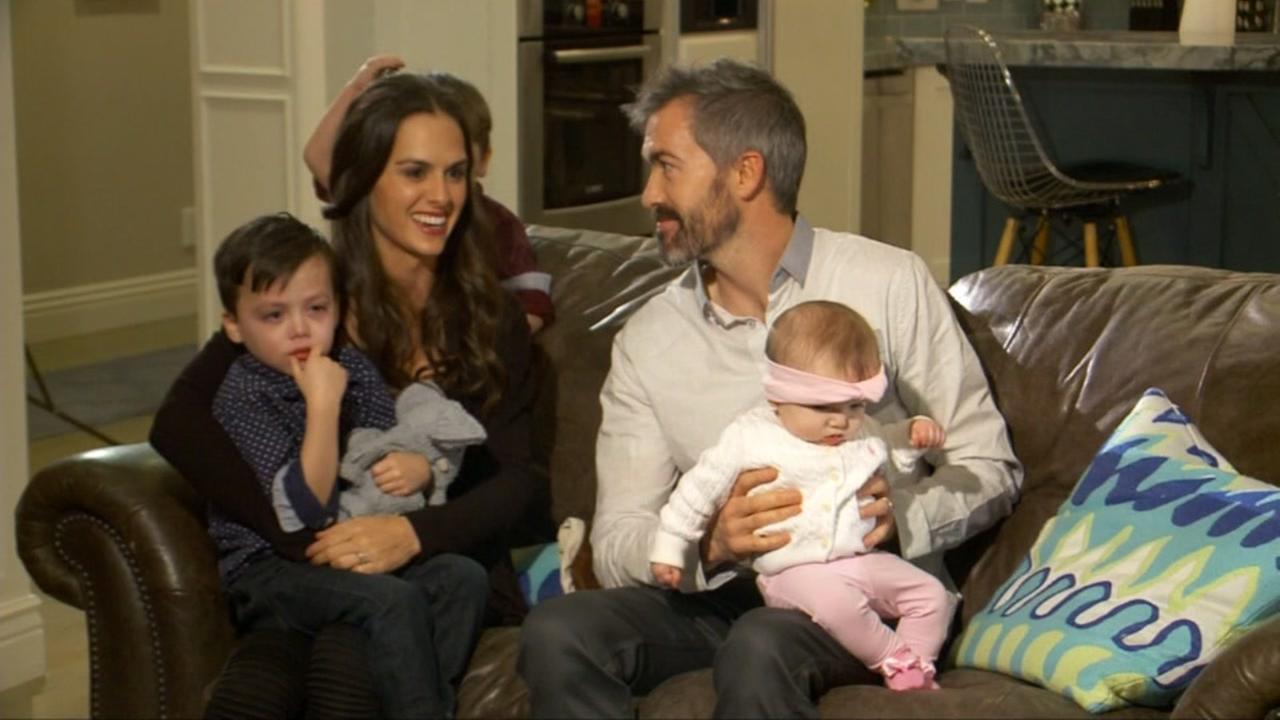 Derek and MKenzie Tillotson sit with their three children in a YouTube video advertising a travel nanny job opening.