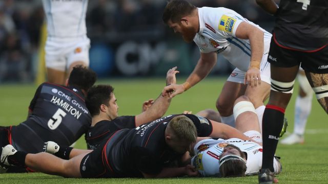 Gone: Richard Barrington assists Geoff Parling after a high tackle that saw Barrington given the first red card under ...