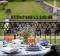 Dining alfresco while overlooking the gardens.